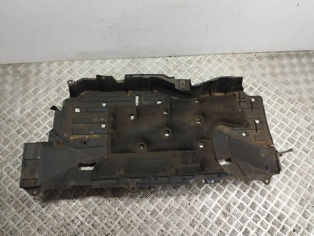 Center/middle under tray cover – left