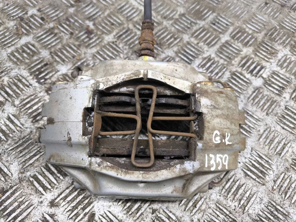 Rear brake caliper – left