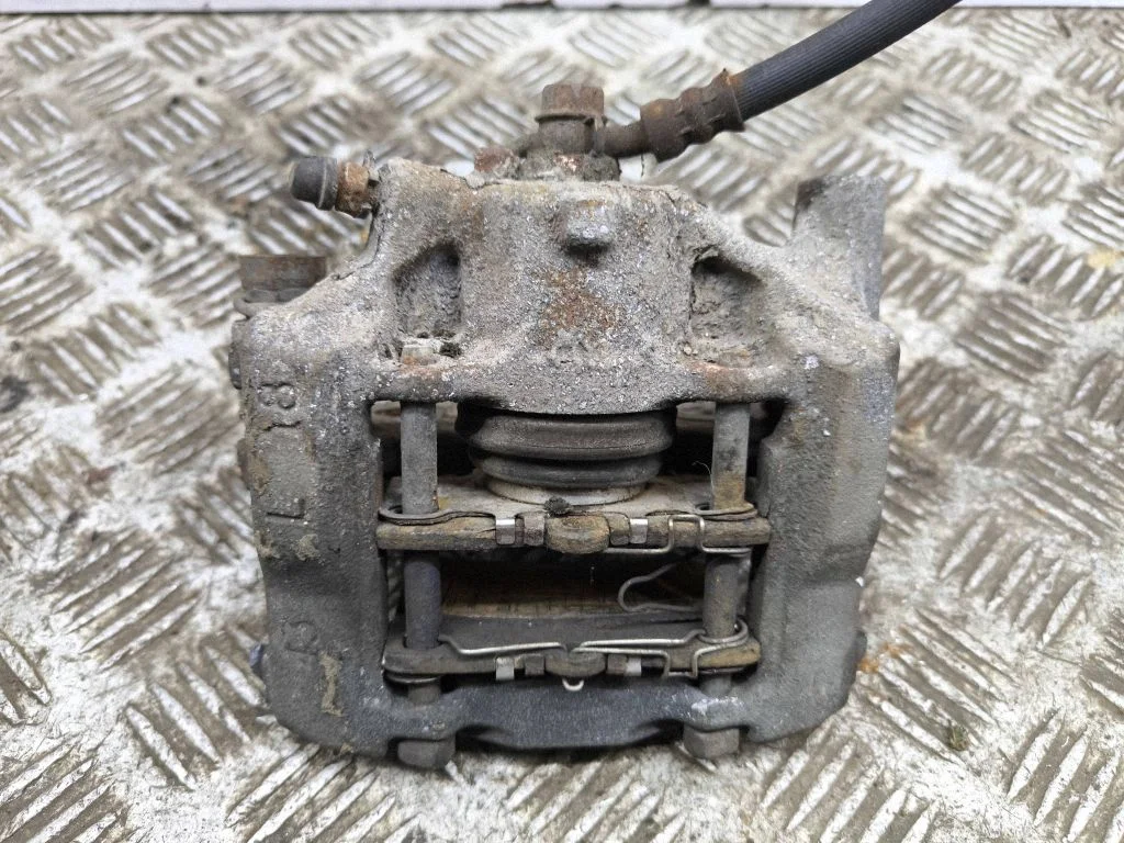 Rear brake caliper – left
