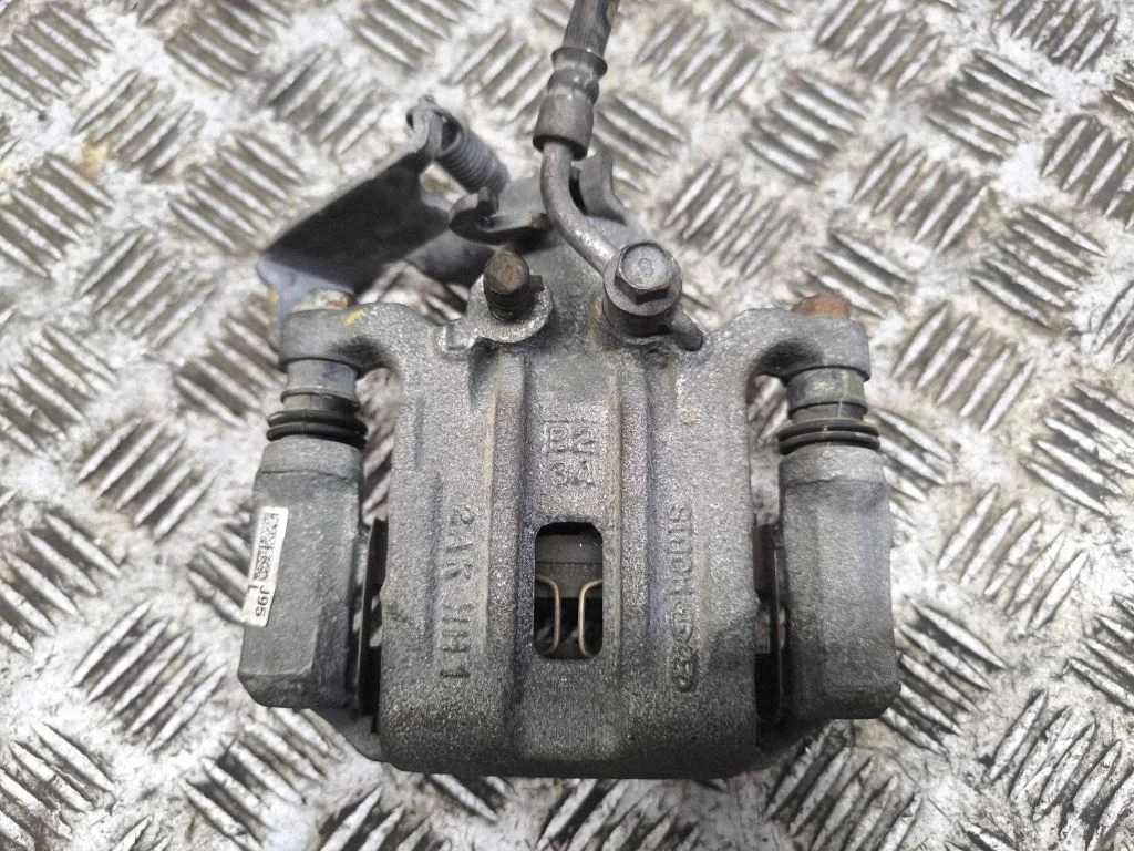 Rear brake caliper – left