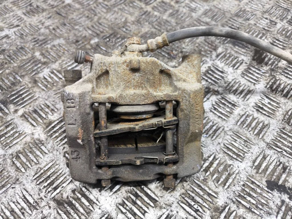 Rear brake caliper – left