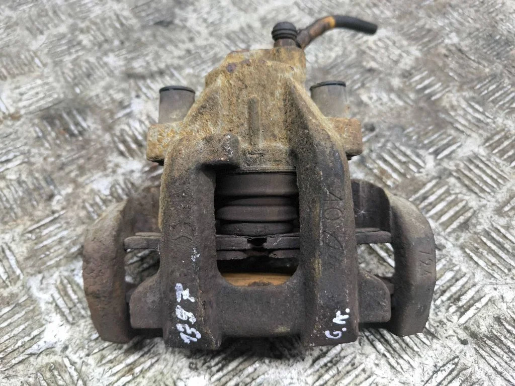 Rear brake caliper – left