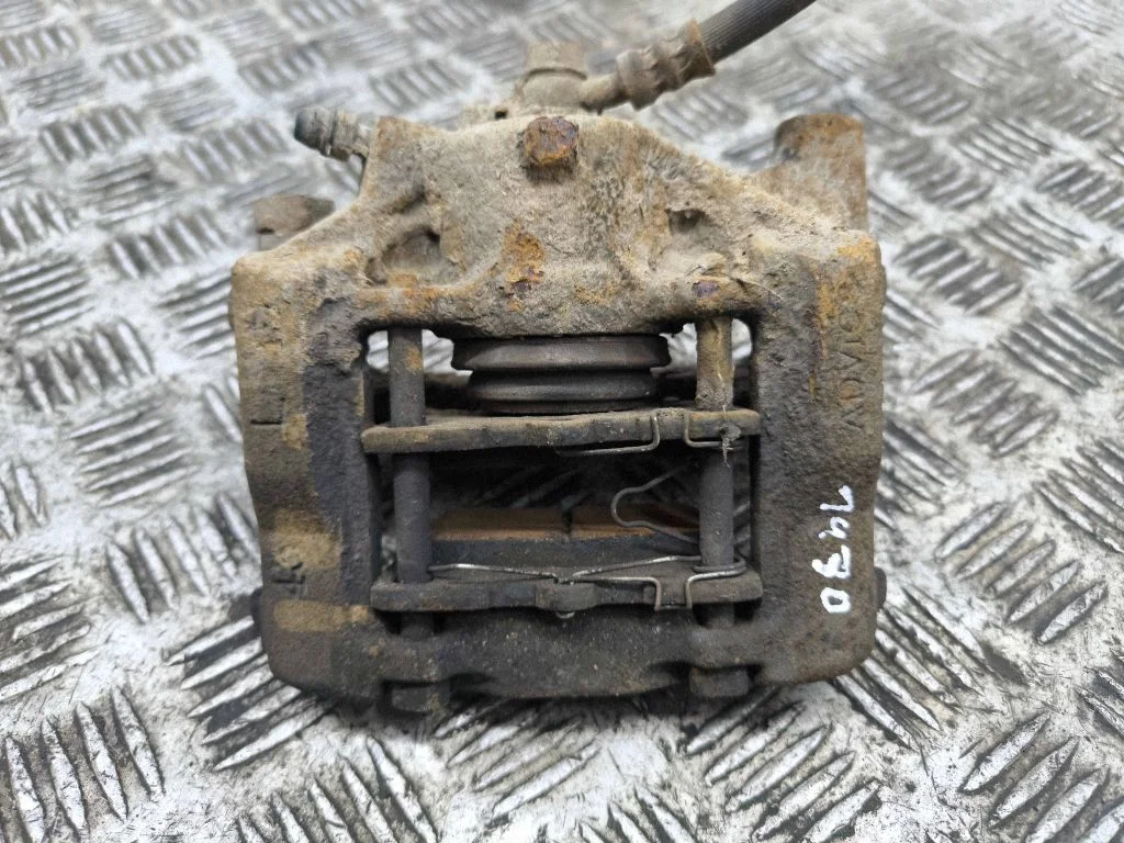 Rear brake caliper – left