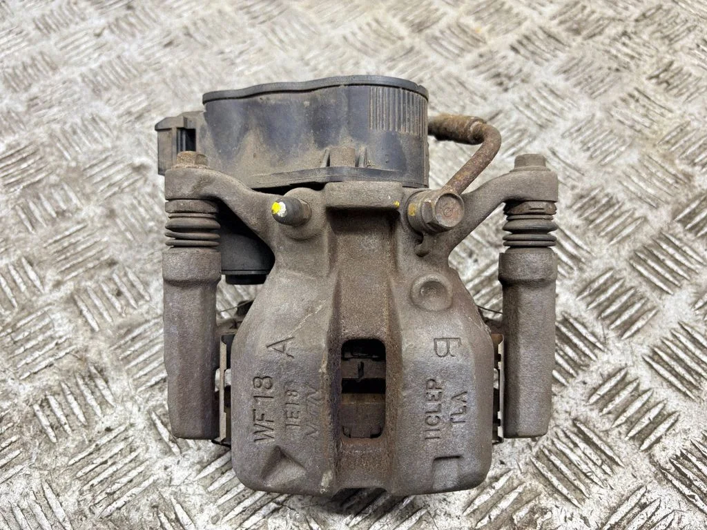 Rear brake caliper – left