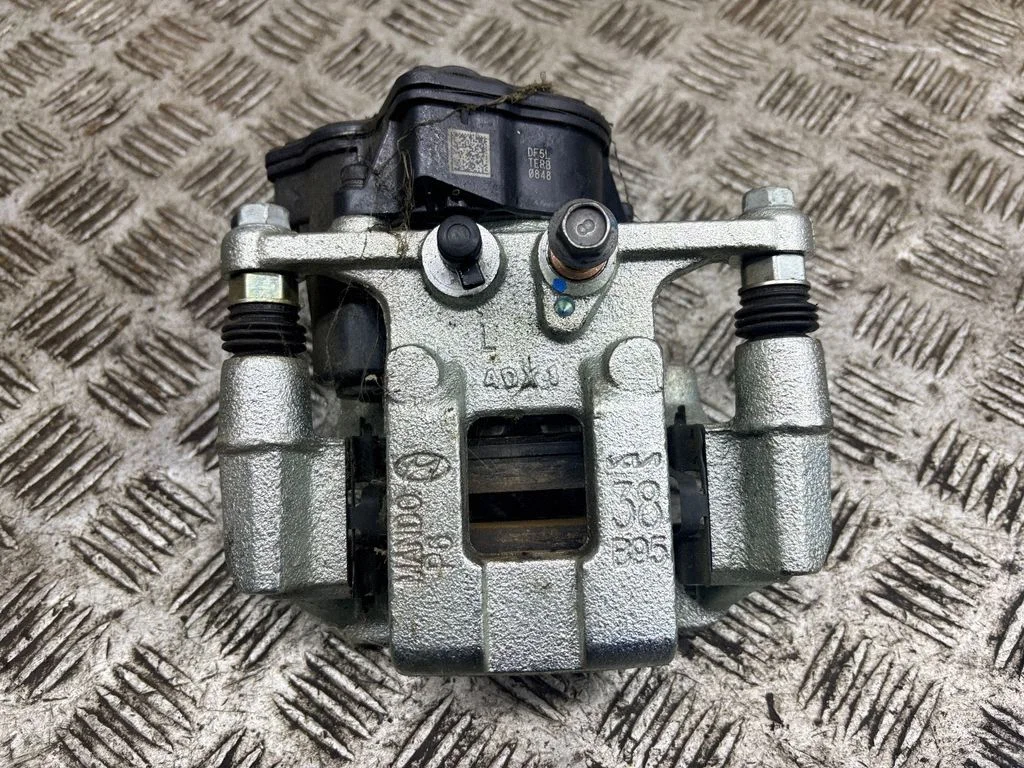 Rear brake caliper – left