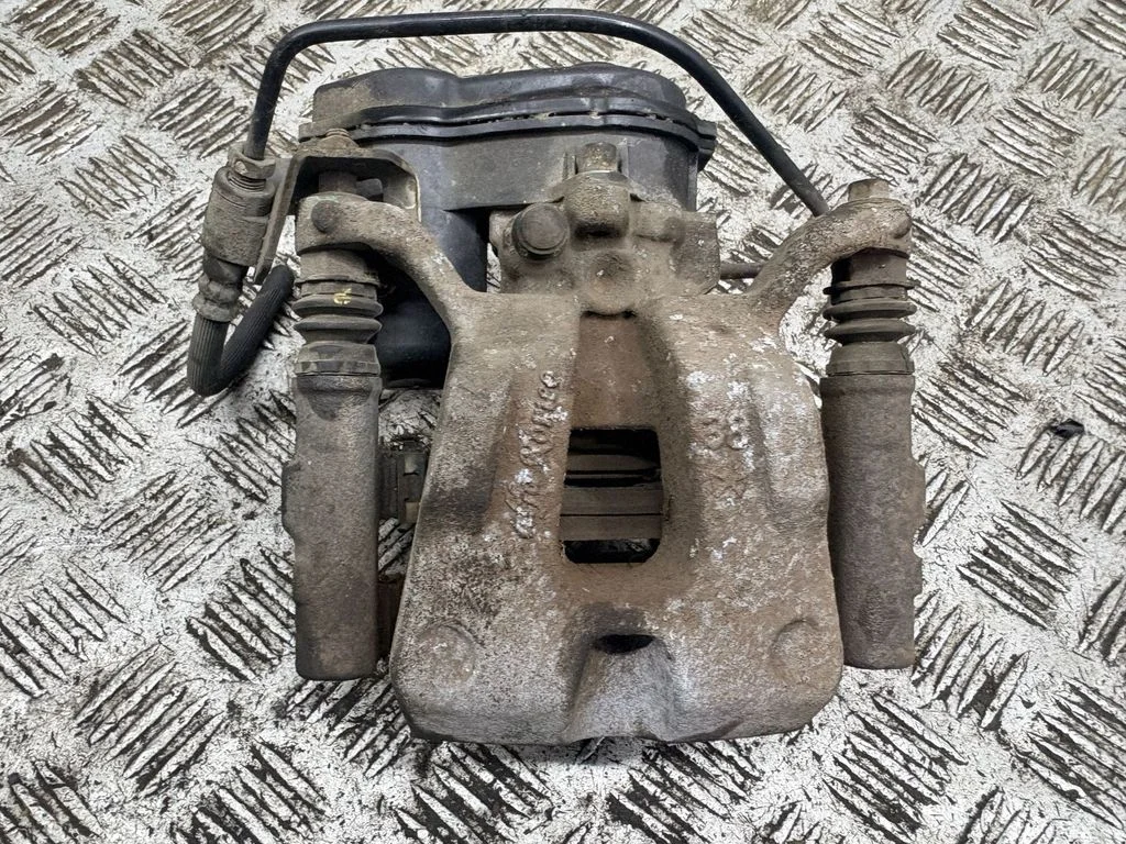 Rear brake caliper – left