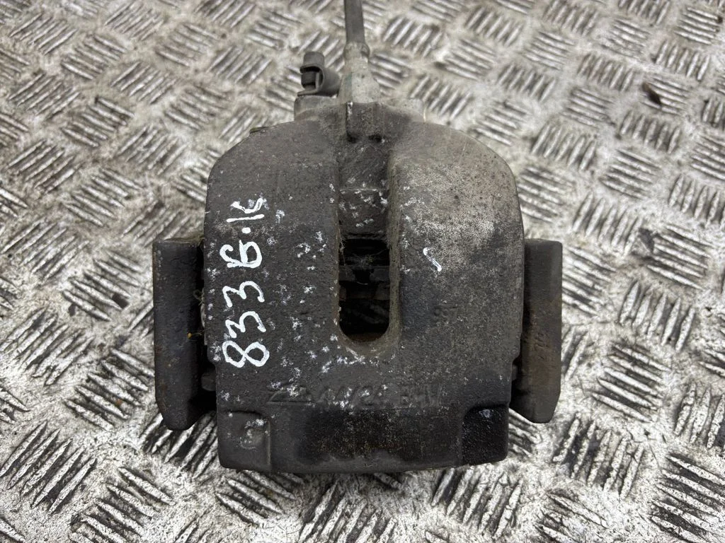Rear brake caliper – left