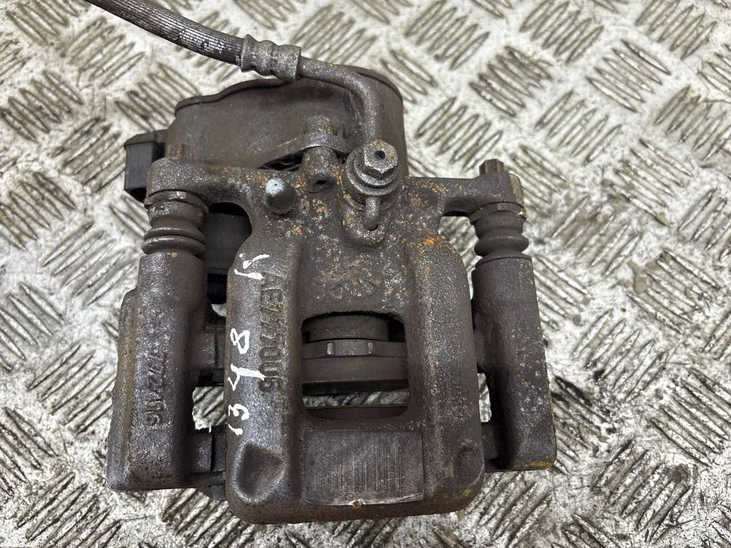 Rear brake caliper – left