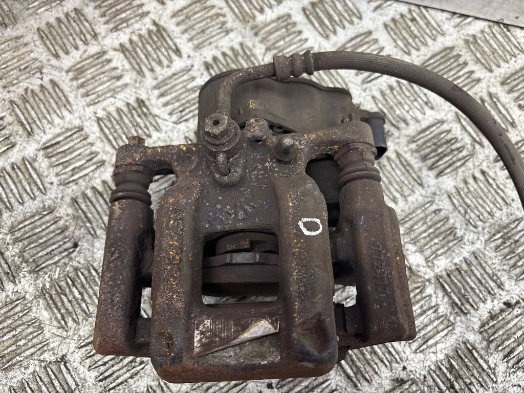 Rear brake caliper – right