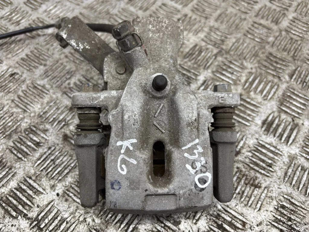 Rear brake caliper – left