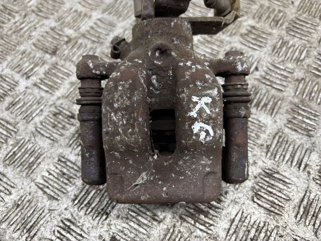 Rear brake caliper – left