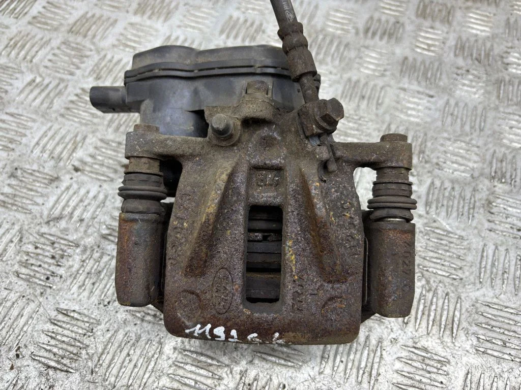 Rear brake caliper – left