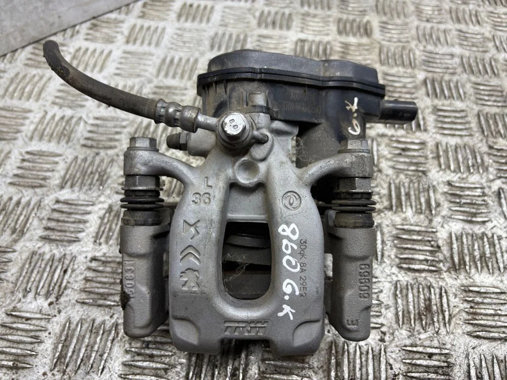 Rear brake caliper – left
