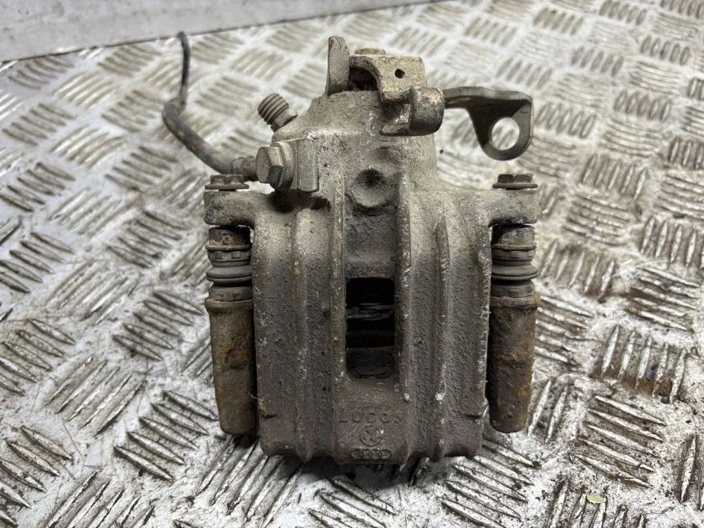 Rear brake caliper – left