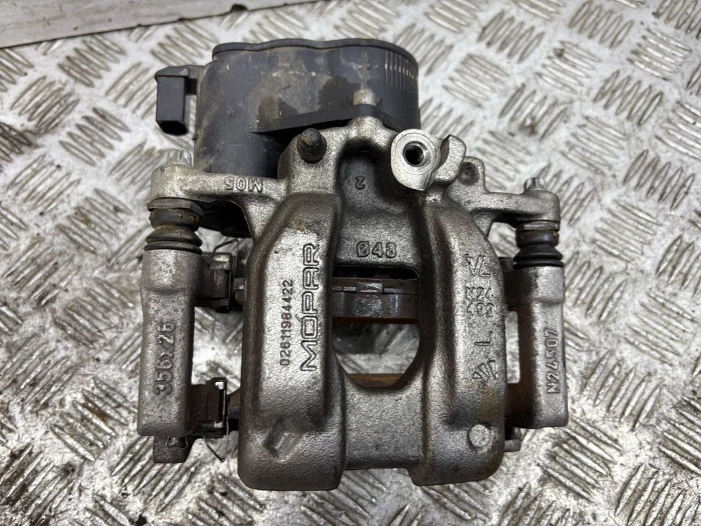 Rear brake caliper – left