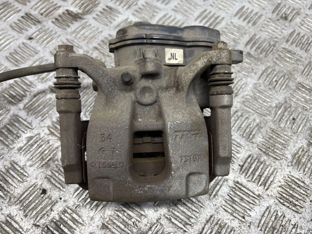Rear brake caliper – left