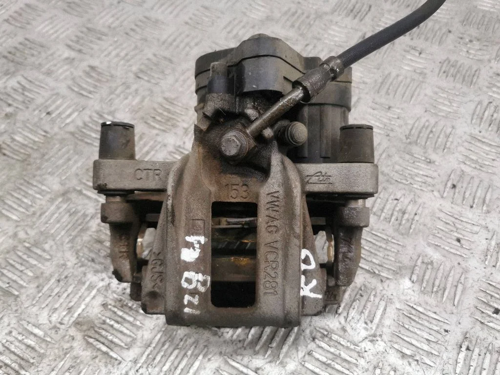 Rear brake caliper – left