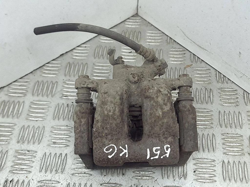 Rear brake caliper – left
