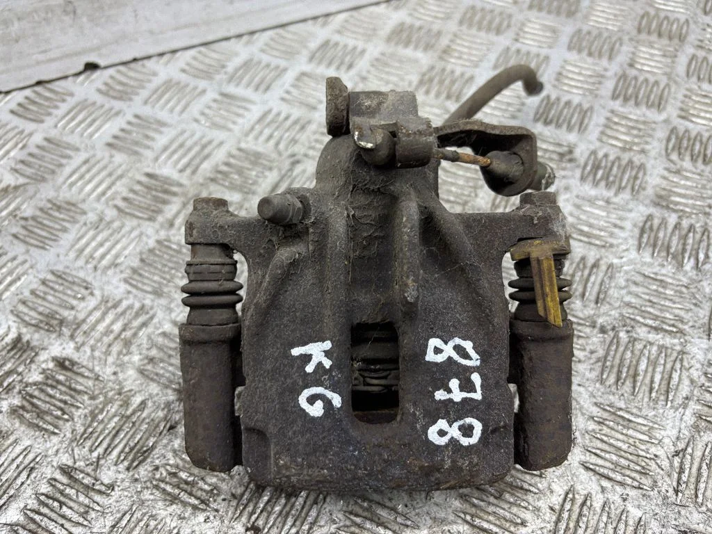 Rear brake caliper – left
