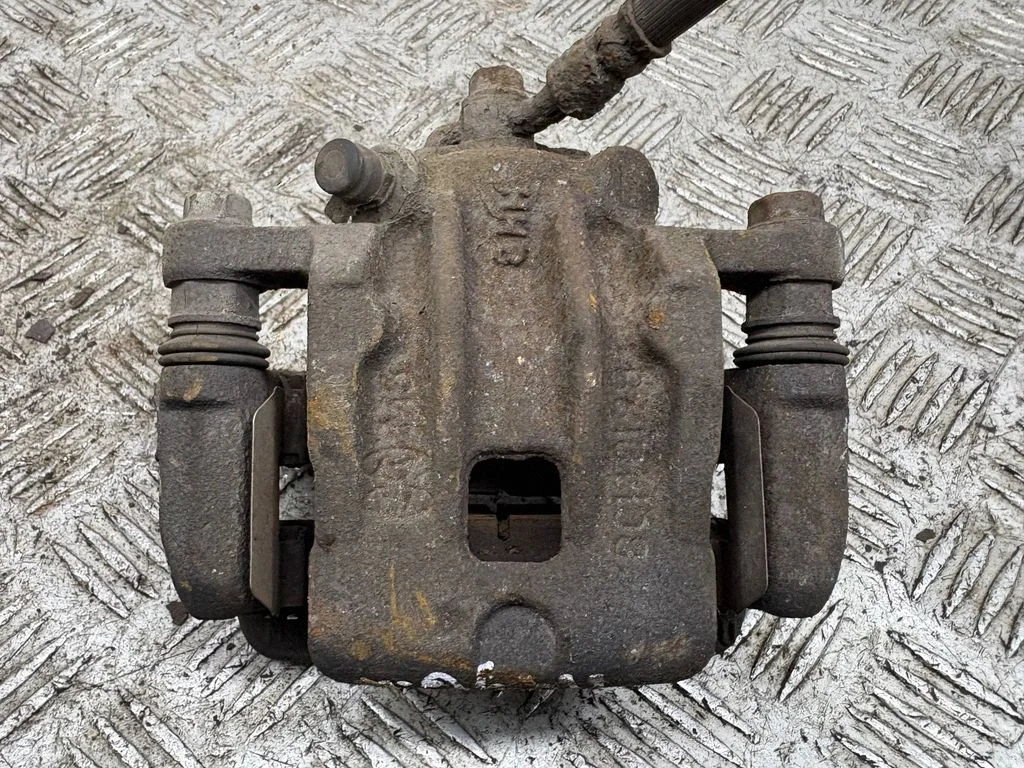 Rear brake caliper – left
