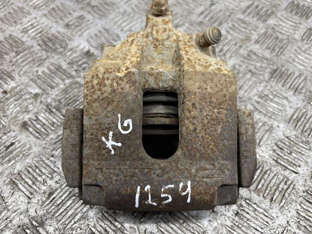 Rear brake caliper – left