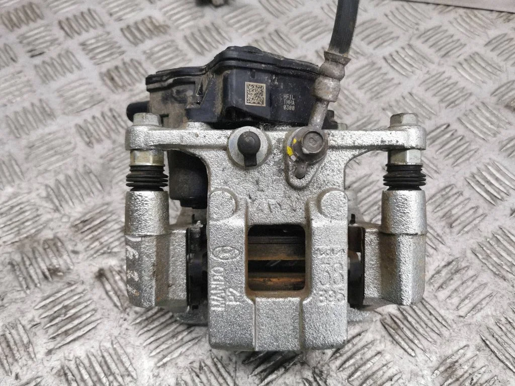 Rear brake caliper – left