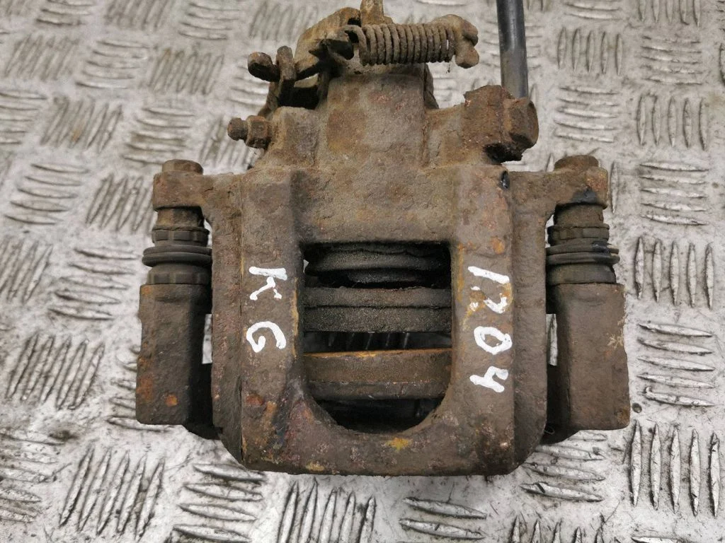 Rear brake caliper – left