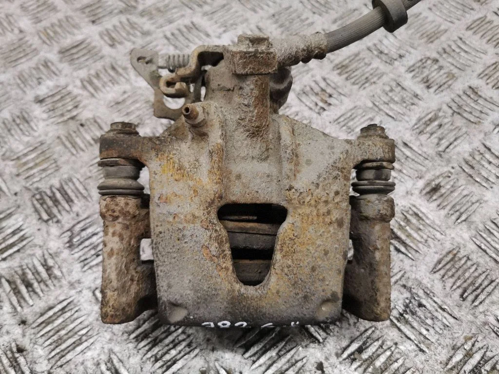 Rear brake caliper – left