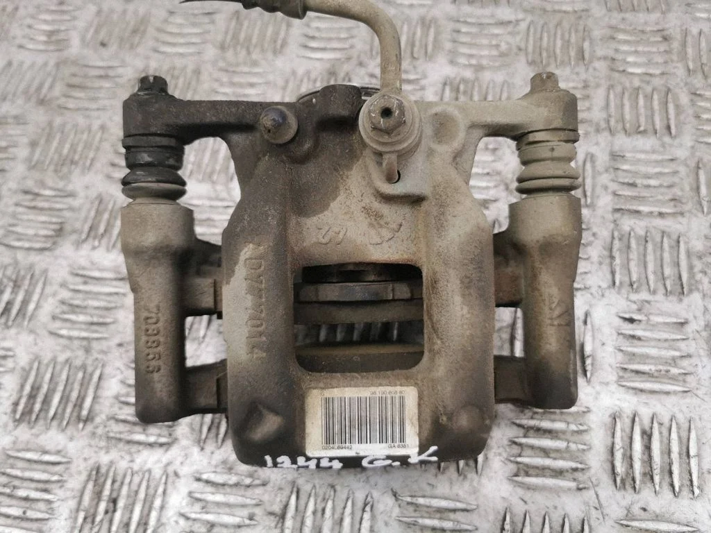 Rear brake caliper – left