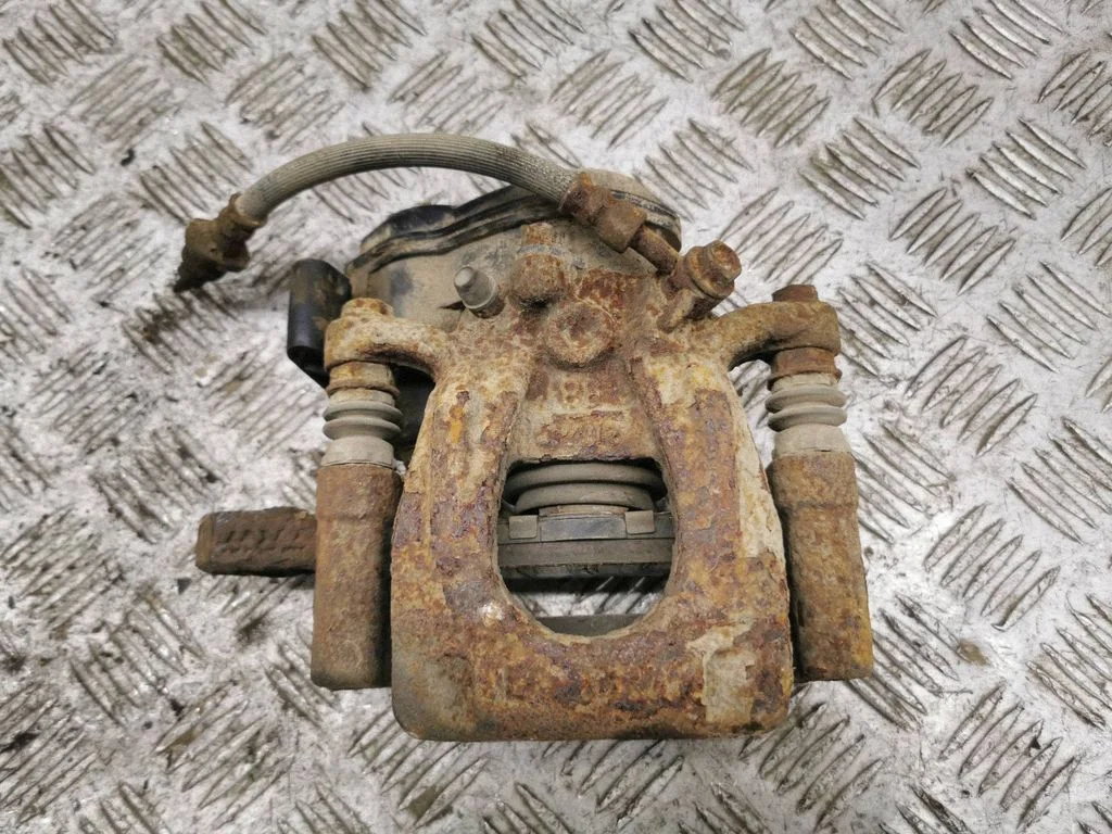 Rear brake caliper – left