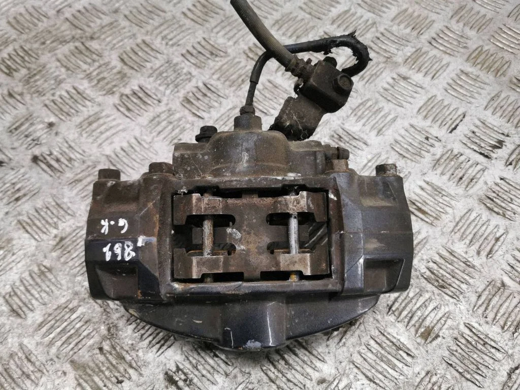 Rear brake caliper – left