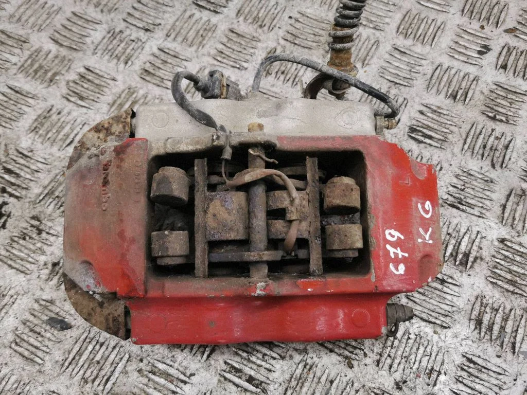 Rear brake caliper – left