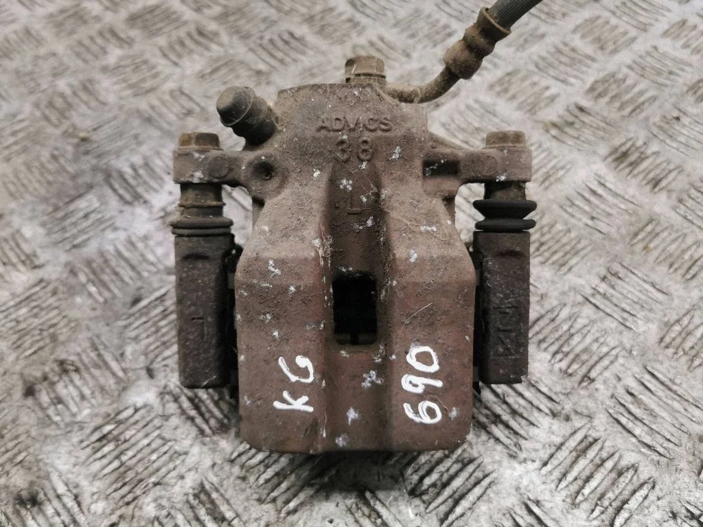 Rear brake caliper – left