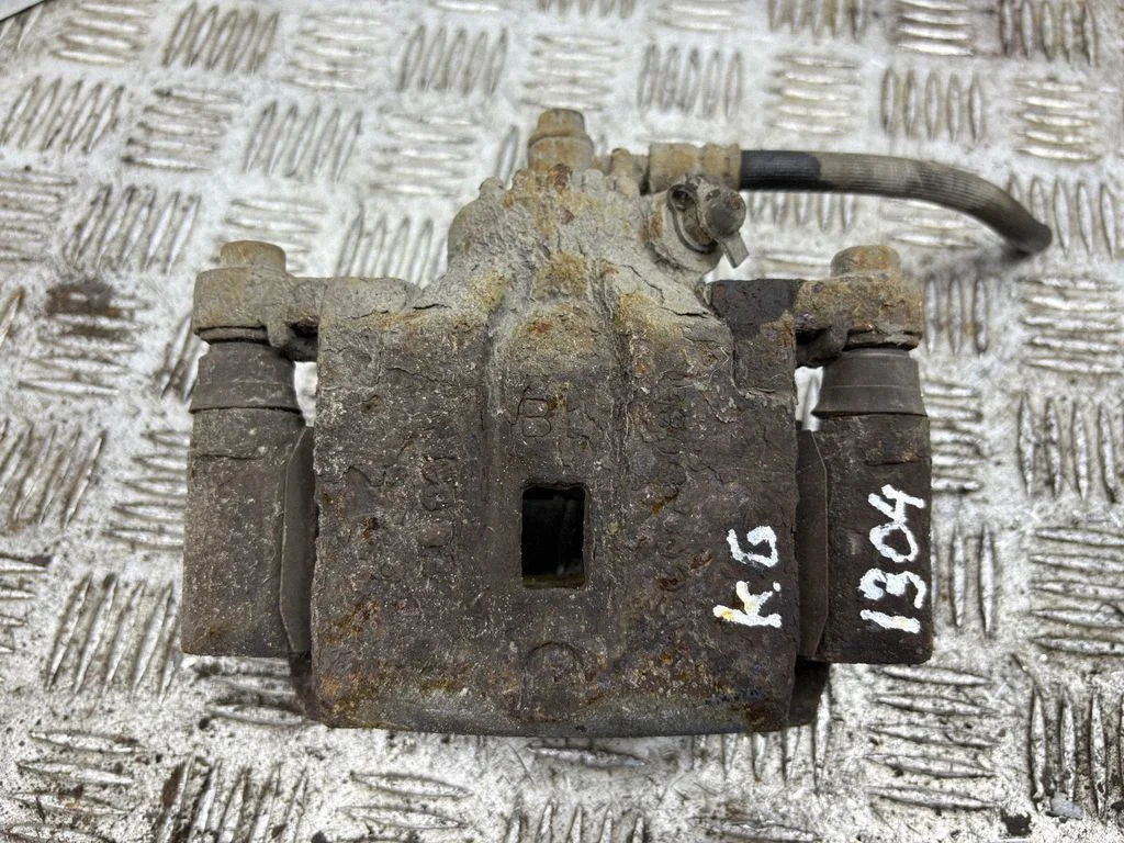 Rear brake caliper – left