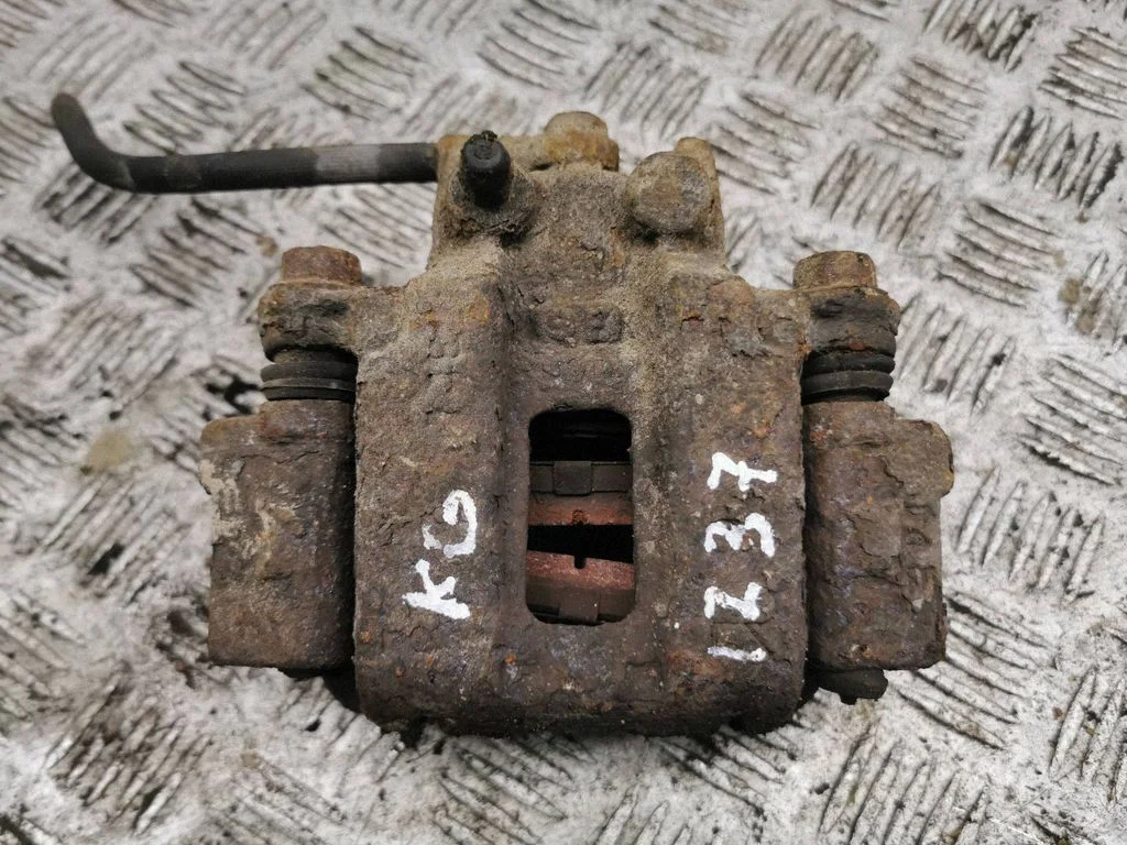 Rear brake caliper – left