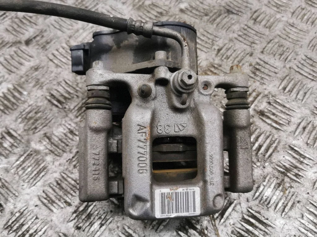 Rear brake caliper – left