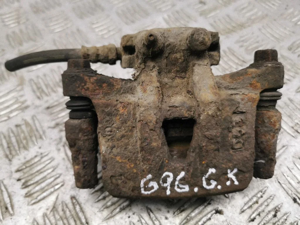 Rear brake caliper – left