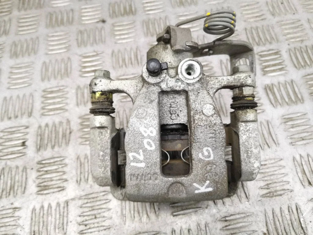 Rear brake caliper – left