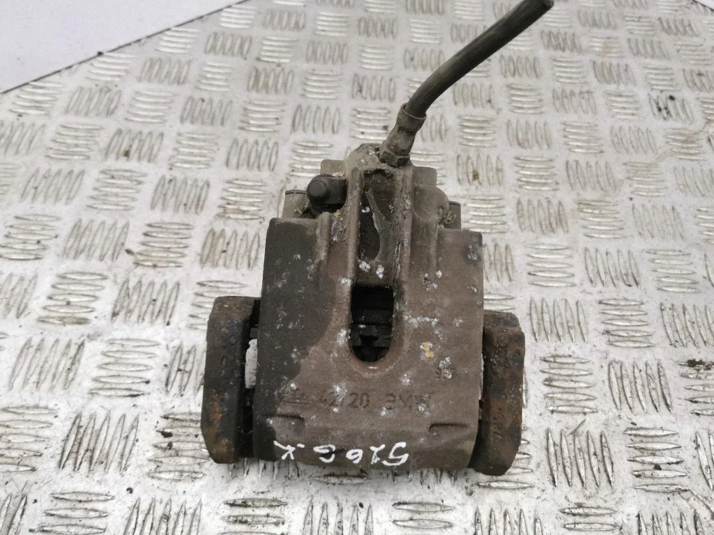 Rear brake caliper – left