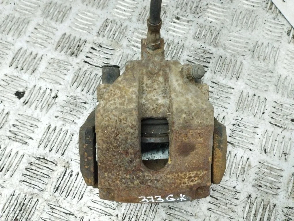 Rear brake caliper – left