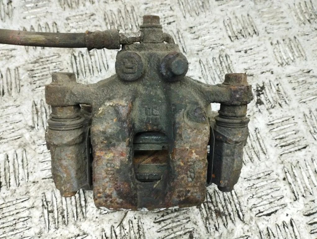 Rear brake caliper – right