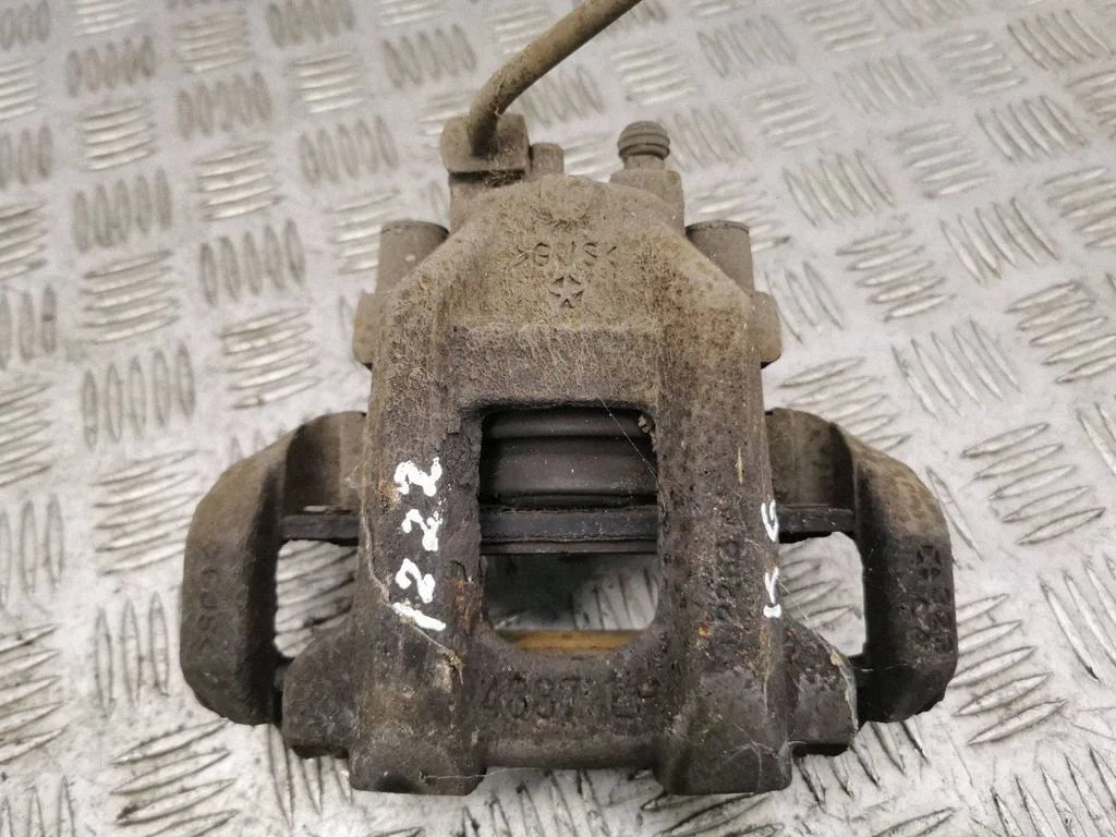 Rear brake caliper – left