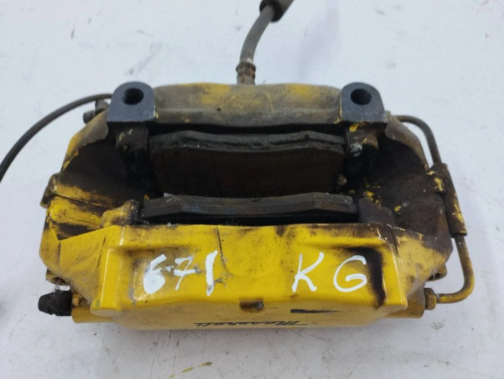 Rear brake caliper – left