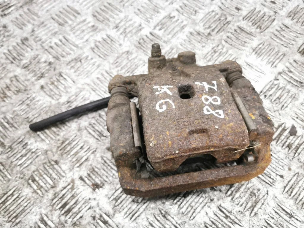 Rear brake caliper – left