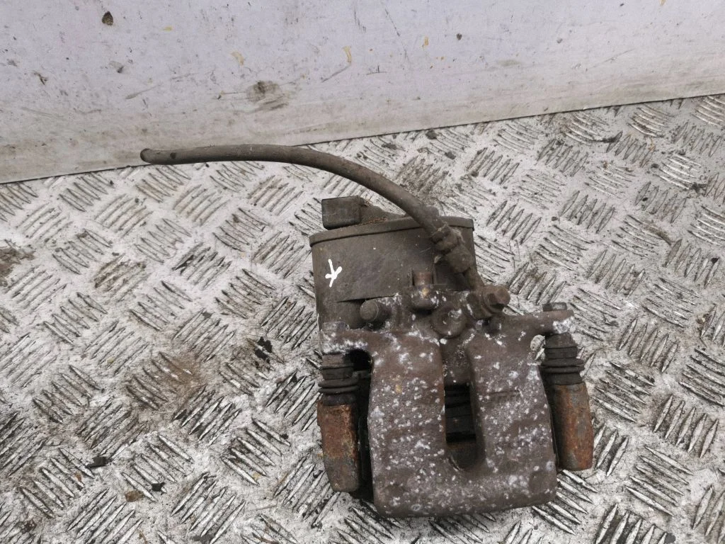 Rear brake caliper – left