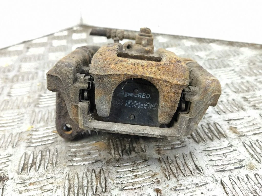 Rear brake caliper – left