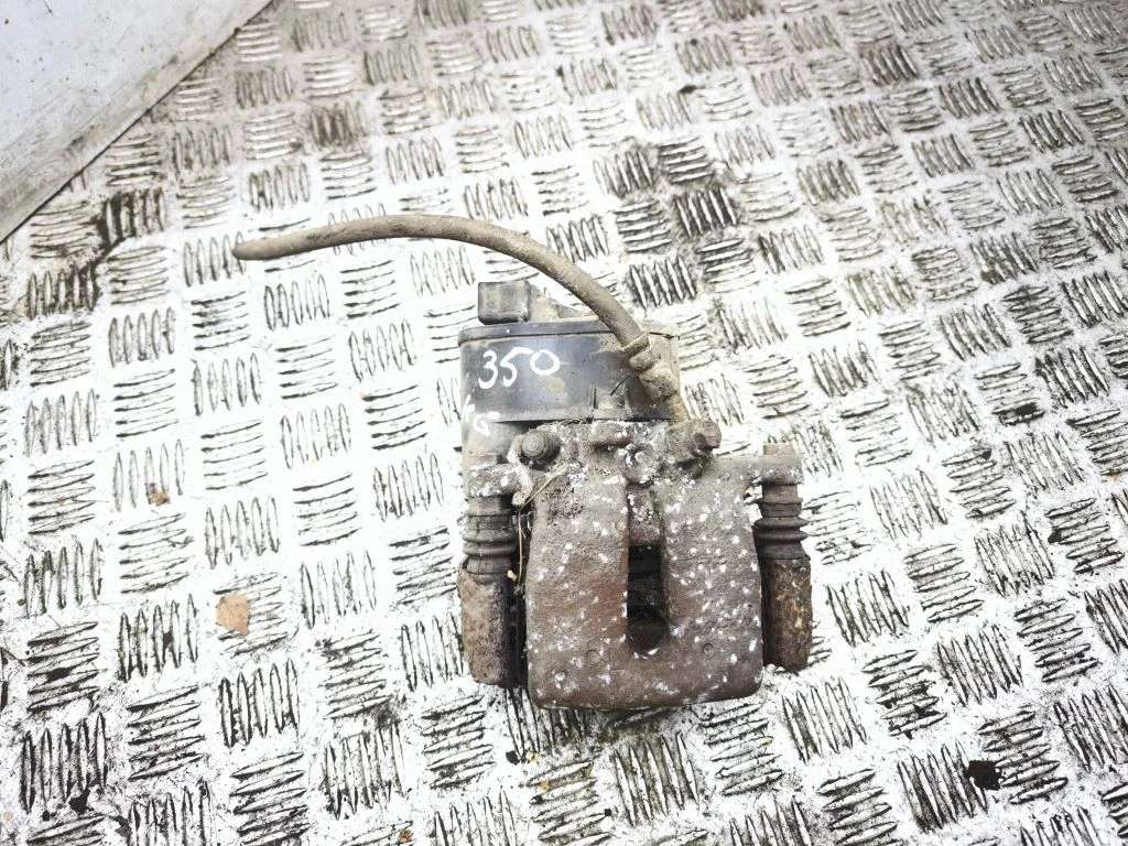 Rear brake caliper – left