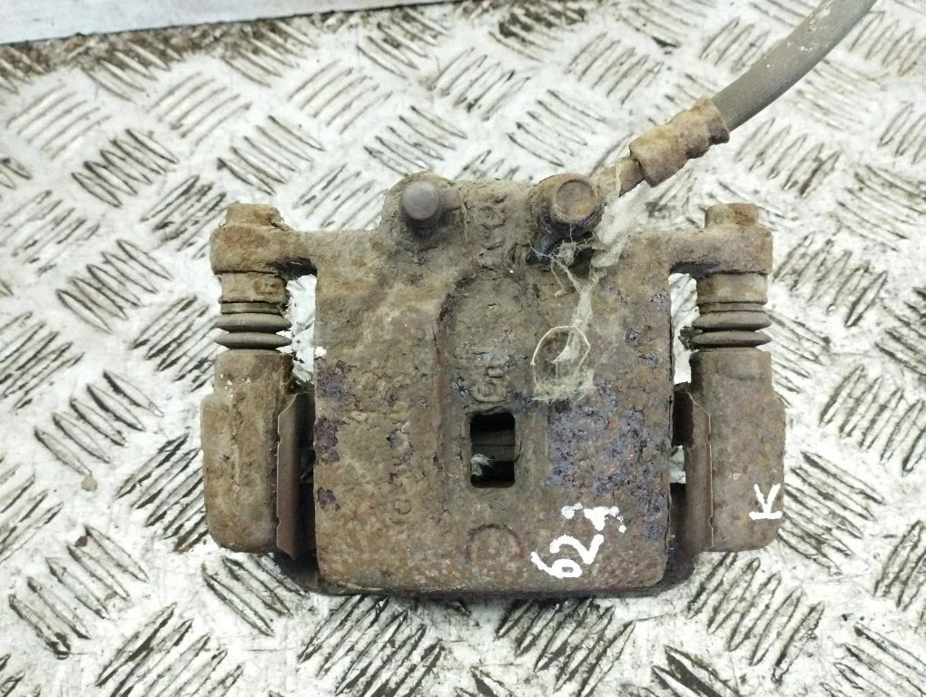 Rear brake caliper – left