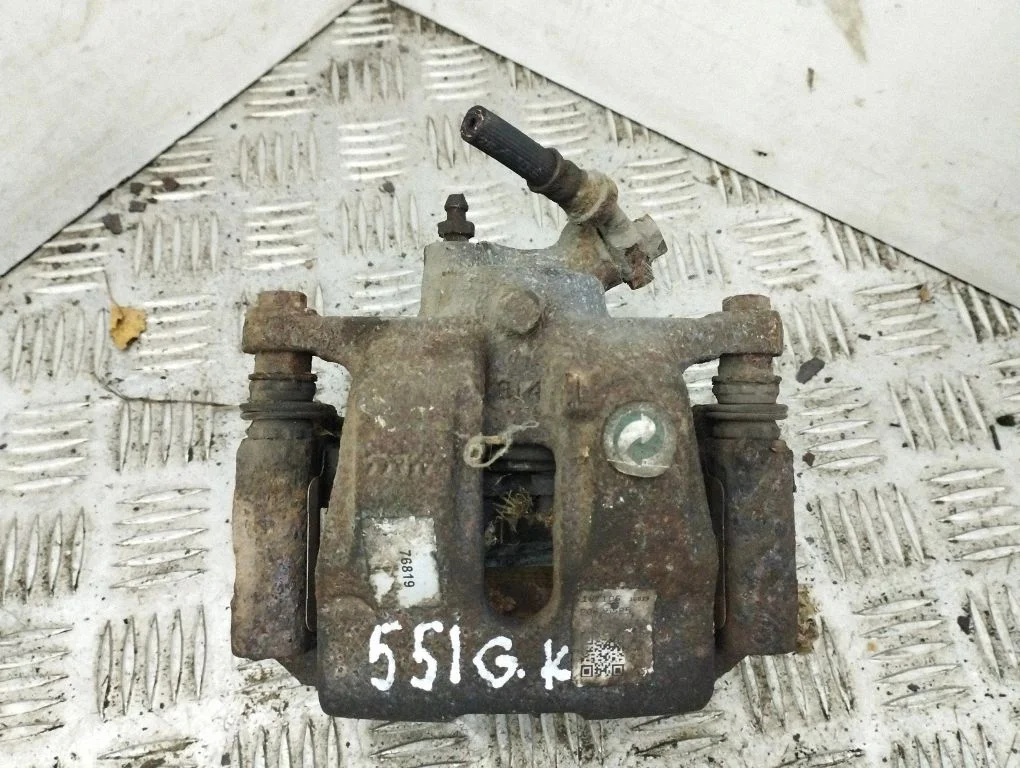 Rear brake caliper – left