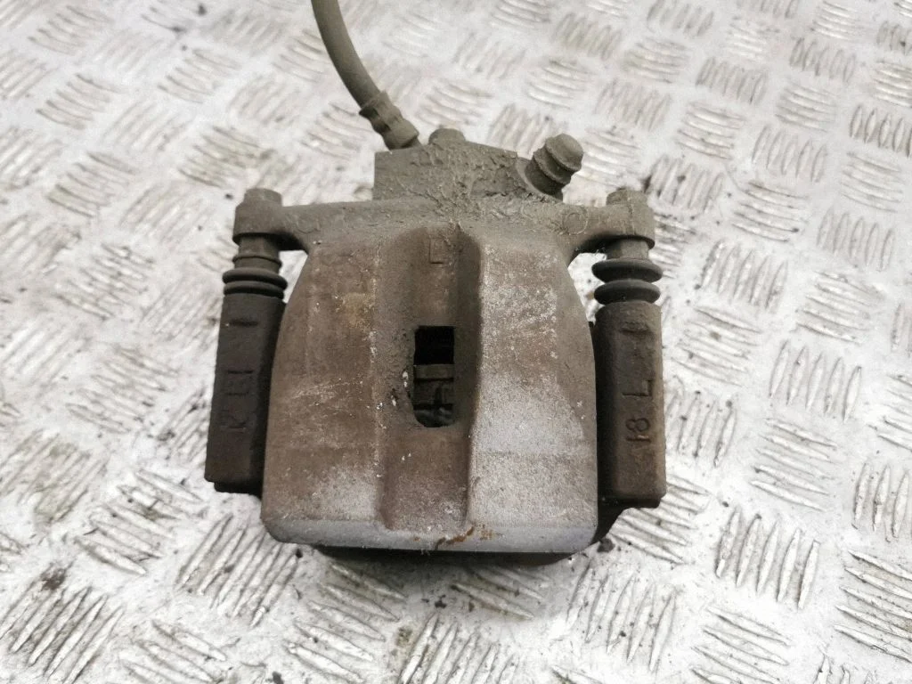 Rear brake caliper – left